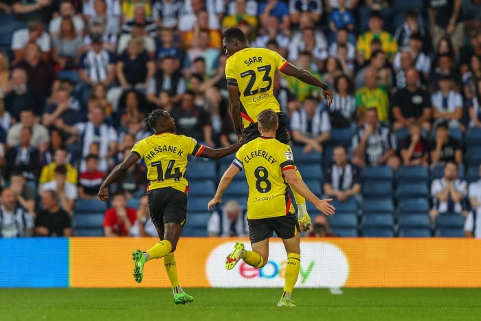 Ismaila Sarr pictured celebrating after scoring a goal from inside his own half for Watford against West Brom in August 2022